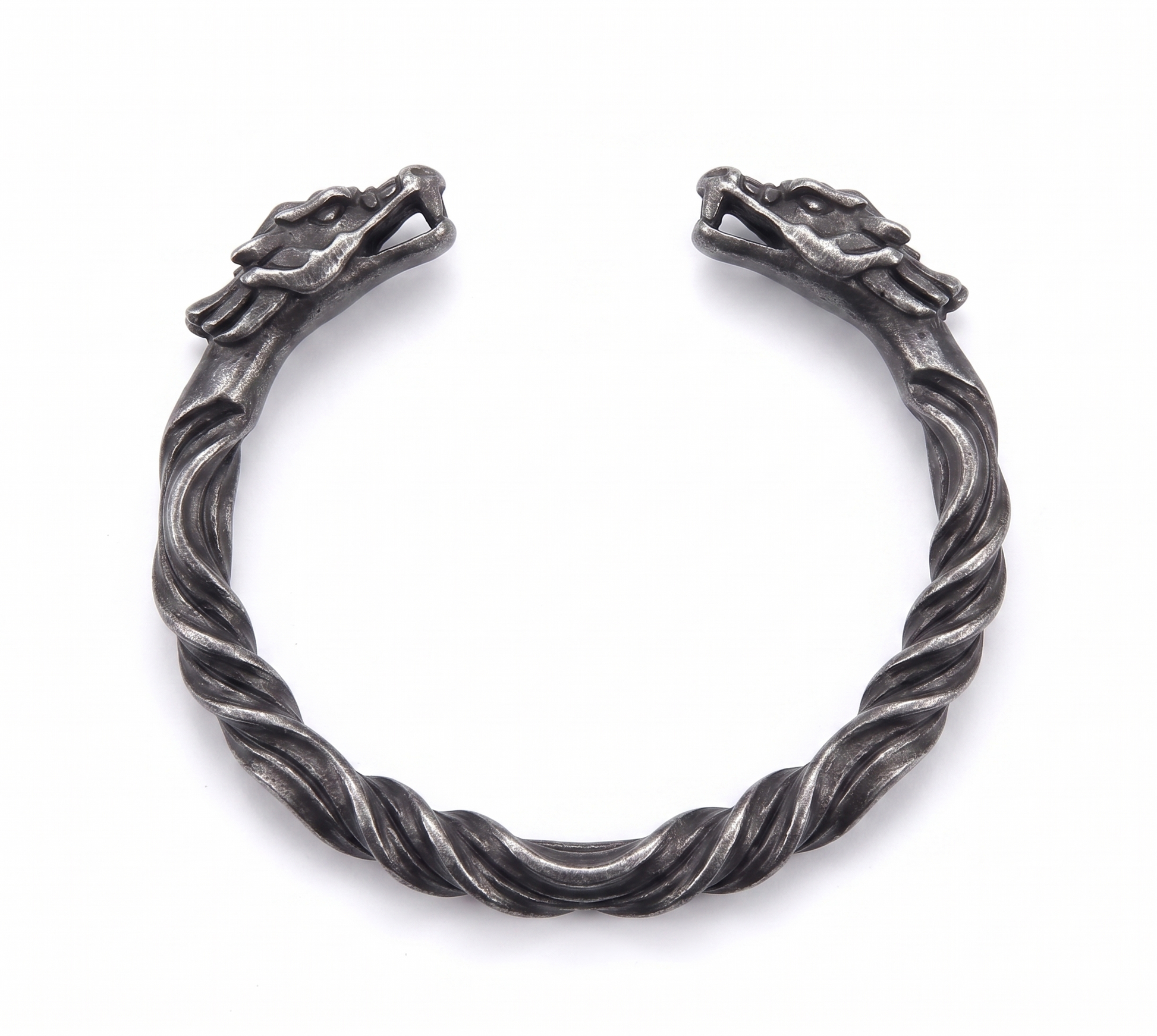 Silver twisted bracelet on a white background